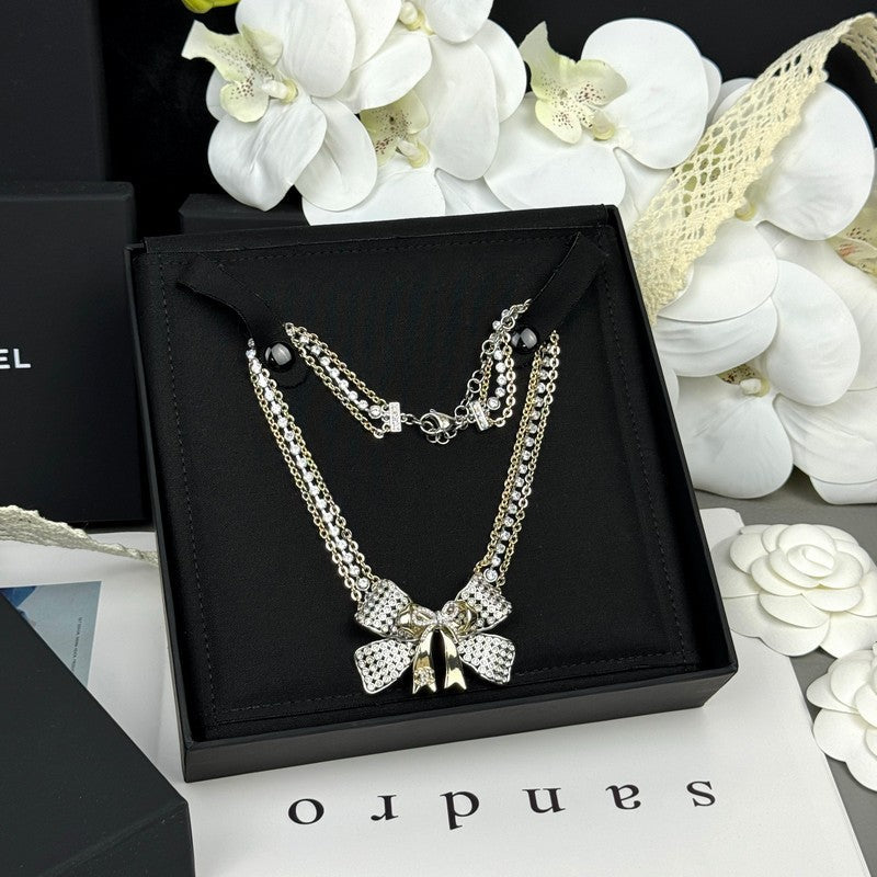 18K  Chanel 25K Bow Tie Choker Necklace
